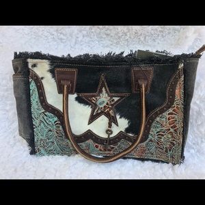 Cowhide fur canvas bag by myra